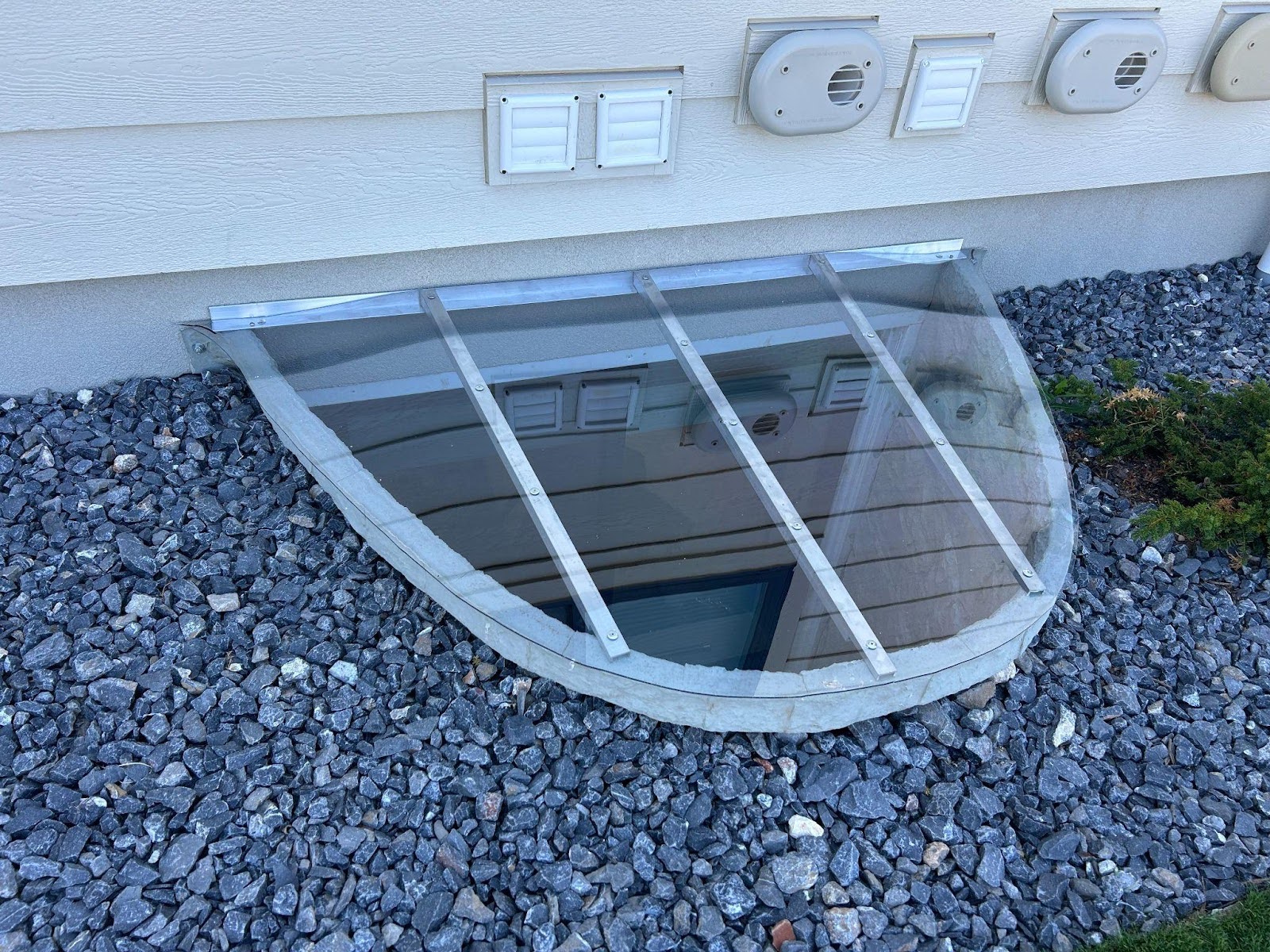 A glass door integrated into a house window highlighting a contemporary style and inviting ambiance