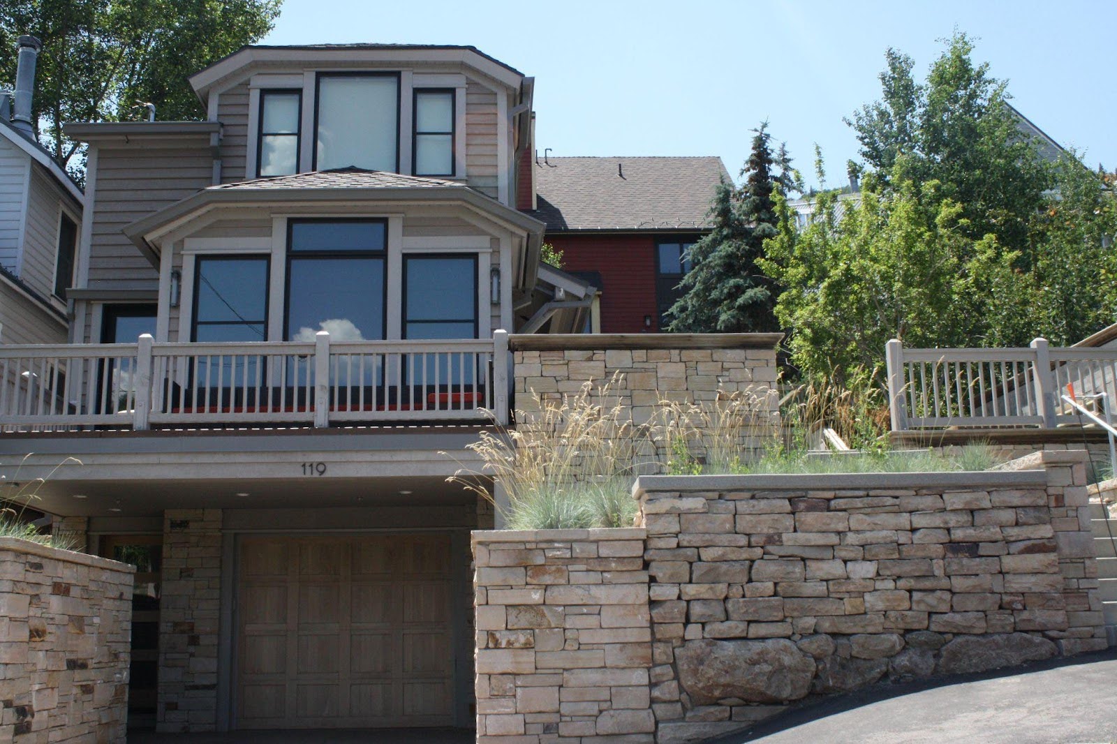 A large weathered stone wall with a rugged texture and various shades of gray and brown